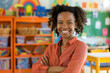 Cheerful black professional preschool teacher smiling confident standing in class of kindergarten or nursery school.