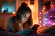 Teenage girl sitting on her bed and checking her smartphone. Teenaged using gadgets at home. Kid reading social media. Internet addiction in children.