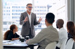 © peopleimages.com - Group, meeting and explaining of boss in boardroom, planning and information for training of staff in startup. City, professional and events company with teamwork for project in New York and people
