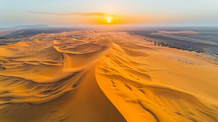 Wall Mural - drone photograph of a vast desert, sand dunes creating mesmerizing patterns, sun setting on the horizon