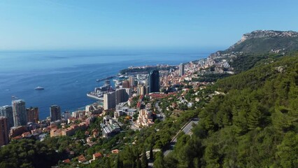 Wall Mural - view of rich city of Montecarlo, tall buildings, narrow streets famous for formula 1 race. mountain, sea and beautiful city on a sunny day vacation. Mediterranean coast