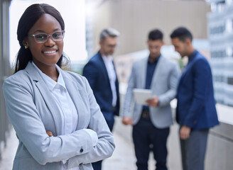 Wall Mural - Portrait, business people and black woman with arms crossed, balcony and confidence with career ambition. Outdoor, employees and lawyer with pride, internship and buildings with candidate attorney