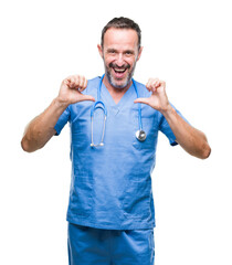 Wall Mural - Middle age hoary senior doctor man wearing medical uniform over isolated background looking confident with smile on face, pointing oneself with fingers proud and happy.