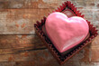 Decorated heart shaped cookie with a pink glaze. Love concept.