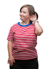 Wall Mural - Young adult woman with down syndrome over isolated background smiling with hand over ear listening an hearing to rumor or gossip. Deafness concept.