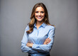 © miha - Confident businesswoman, blue shirt, stylish executive, arms crossed, gray background