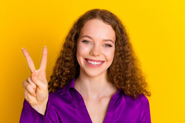 Canvas Print - Photo portrait of pretty young girl show v-sign wear trendy violet outfit isolated on yellow color background