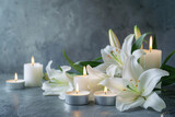 Fototapeta  - Elegant white lilies and glowing candles on a textured grey background, symbolizing peace and remembrance for a funeral condolence setting