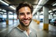 © mamo studios - smiling man in a parking garage