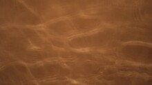 Abstract Video For Backgrounds, Water Moving In A Salmon-coloured Fine Cement Bathtub