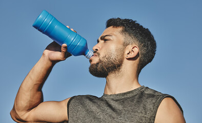 man, water bottle and drink with blue sky in nature, outside and hydration for exercise and thirsty.