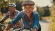 © LoLArt - Happy senior couple cycling outdoors leading active healthy lifestyle at retirement happy aging together