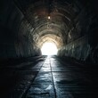 Dark and mysterious tunnel with a single light at the end