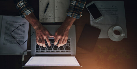 Businessman, programmer and typing on laptop in office with paperwork for data analytics, coding and software script. Top view, tech expert and employee hands with programming, it developer and notes