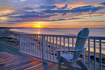 House On The Beach. Adirondack Chair on Deck Overlooking Ocean Sunset