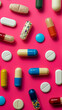 Top-down view of Medication diversity displayed on a pink background