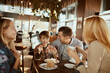 © Davor - Family enjoying time together at a cafe