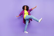 © deagreez - Full size photo of pretty young girl dancing step wear trendy plaid outfit isolated on purple color background