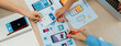 © Summit Art Creations - Panorama banner of startup company employee planning on user interface prototype for mobile application or website in office. UX UI designer brainstorm user friendly interface plan. Synergic
