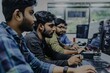 © Iftikhar alam - Indian men sitting in front of computers, collaborating on software development in an office setting, A group of Indian men collaborating on a software development project
