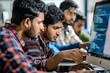 © Iftikhar alam - Group of Indian men sitting in front of a laptop, working together on software development projects, A group of Indian men collaborating on a software development project