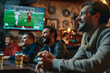 © Di Studio - football fans drinking beer and watching soccer game in the sportsbar