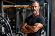 © Di Studio - Mature muscular man in modern gym on background