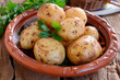 Pile of raw potatoes on wooden table