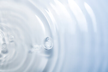 Wall Mural - the clear blue surface of the water gradients from light to dark.