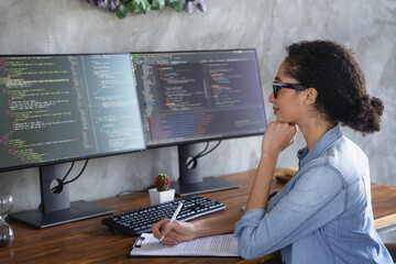 Profile portrait of young girl it specialist hold pen clipboard look monitor loft interior business center indoors