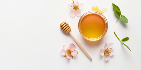 Wall Mural - jar of honey with honey stick and bright flowers on a light background