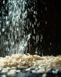 Rice being sprayed on a black background.