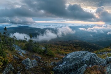 Poster - View of clouds and mountain peaks from atop a majestic mountain, A panoramic view from a mountaintop with clouds rolling in over the horizon