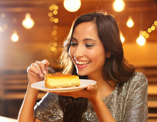 Woman eats a piece of cake Tarta de Santiago.
