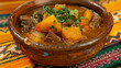 Classic mongolian beef stew with carrots and potatoes in a rustic bowl, presented on a colorful woven tablecloth, showcasing cultural cuisine