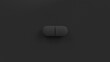 Black single pill isolated on a black background. Tablet, pill top view, flat lay. 3d render illustration 