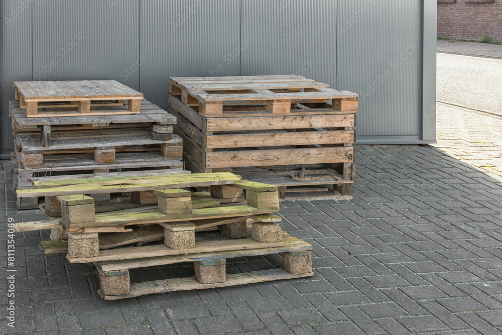 wooden industrial pallets are stacked on top of each other