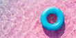 blue inflatable ring in a beautiful pink crystal clear pool