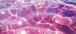 closeup of pink pool water reflecting waves on a summer day
