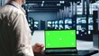 © DC Studio - Programmer in server room expertly managing data while navigating through industrial rackmounts. Worker ensuring flawless cybersecurity cover, optimizing systems using chroma key laptop