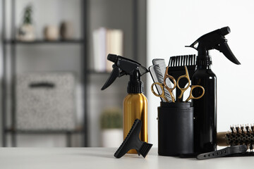 Poster - Set of hairdresser tools on table in salon, space for text