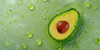 Top view half a ripe avocado in drops of water or oil on a green background.