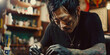 Portrait of an asian tattoo artist at work.