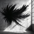 A large abstract painting with a black paint splatter design on a wall next to a window.