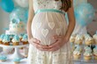 Photo of pregnant woman's belly, baby shower party in blue color. Boy's birth celebration. Blue decor. Girl gently embraces her pregnant belly. Waiting the newborn. Balloons, cupcakes, cakes.