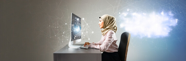 muslim woman working on computer in office