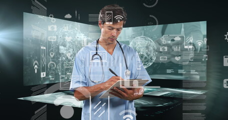 Wall Mural - caucasian male doctor wearing scrubs, writing on clipboard