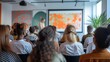© Sergei - Audience in a modern lecture hall viewing a screen with colorful abstract diagrams during a seminar.