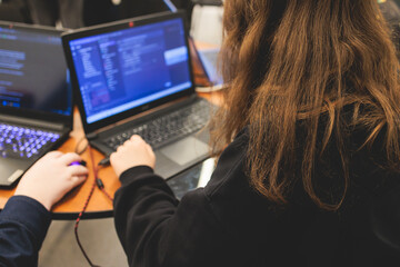 Female software developer students working on computer and laptop, programming contest hackathon competition, pc with coding program app, competitive programming for software engineer