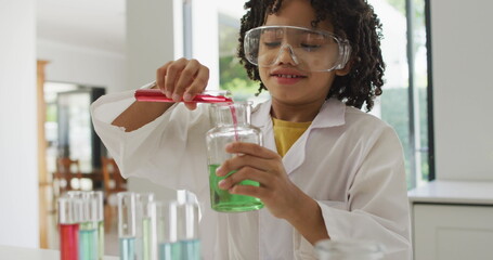 Poster - Image of shapes over african american schoolboy at science class